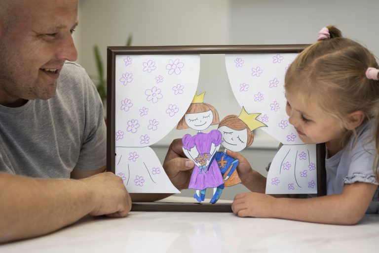 father-daughter-playing-with-puppets